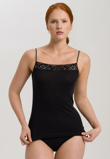 The Moments range from Hanro is super feminine, understated and elegant.  The Spaghetti Top in black is crafted from soft 100% mercerised cotton and features stretchy French lace at the straight neckline.  With a figure hugging fit this is just the thing for under your blazers or knitwear.   