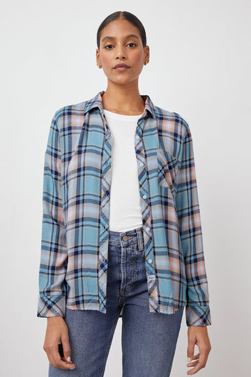 Casual dressing at its best, the Hunter shirt by Rails has become a firm wardrobe favourite of ours. We definitely love this spring version in a teal, peach and navy plaid and we want to add it to our growing collection. The ultra-soft button down comes with long sleeves, one chest pocket and a curved hem. 