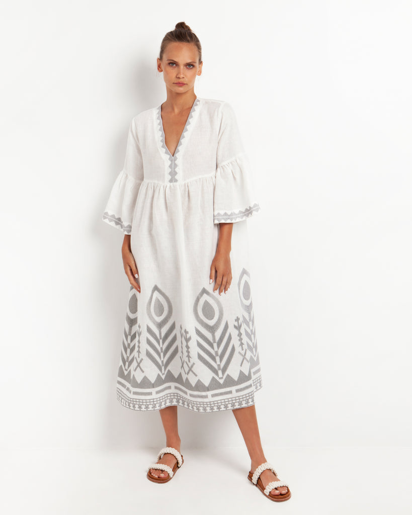 This beautiful empire line midi dress from Greek Archaic Kori has a v-neckline and gorgeous 3/4 length bell sleeves.  It features a slight split at the front hem and feather chevron embroidery.  Pair with your favourite sandals for a fresh and elegant summer look.