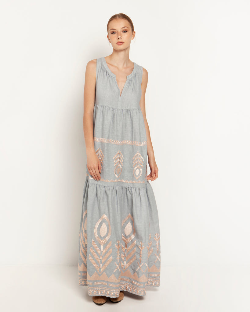 This Maxi sleeveless dress from Greek Archaic Kori features an open v-neck with pretty pink bronze embroidery to add luxury to the style. Its tiered and loose fit is perfect for the hot sunny days to come or for that special holiday.  Pair with espadrilles or your favourite flip-flops for a more relaxed summer look.   
