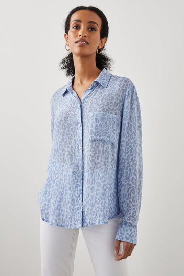 Calling all animal print lovers - the Josephine Top from Rails crafted from feather soft lightweight rayon in a pretty pale blue batik cheetah print is for you.  With a classic relaxed fit, buttons down the front and patch pockets at the chest this looks perfect paired with white denim.