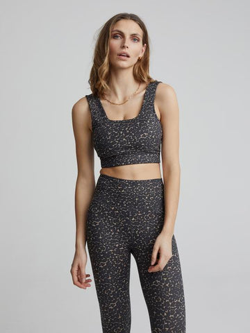 The Let's Move Delta Bra is crafted from a breathable fabrication produced from recycled fibres. Featuring an interior elastic band, removal cups and wide straps, this bra offers full support and is perfect for all your workout classes. Pair with the Let's Move Leopard Print Leggings for the complete look. 
