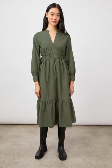 The Maple Midi is a perfect transitional dress and one you will reach for again and again.  Crafted from crisp cotton poplin and featuring long sleeves, a flattering v neck, banded collar, swingy fit, concealed adjustable drawstring waist and flowy tiered skirt this will take you from work to weekend with style.  