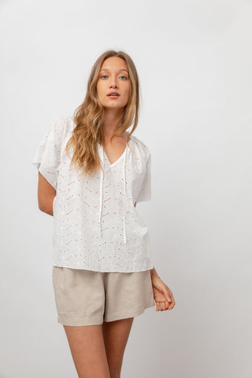 This pretty super feminine top from Rails is perfect for when the weather heats up.  Crafted from ultra lightweight textured cotton and featuring a flattering v neck, floral eyelet embroidery throughout, a relaxed fit and dainty flutter sleeves this is perfect paired with your favourite denim or shorts.