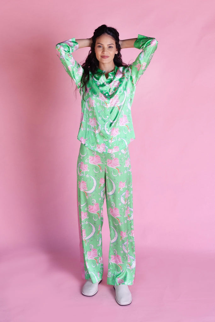 This luxurious PJ set features hand painted prints and starry orbits. The 95% silk fabric top has a button-down front and a pocket detail. The accompanying Ophelia's Orbit PJ Bottoms feature a drawstring tie and contrasting pink trim.  These are super feminine and fun!