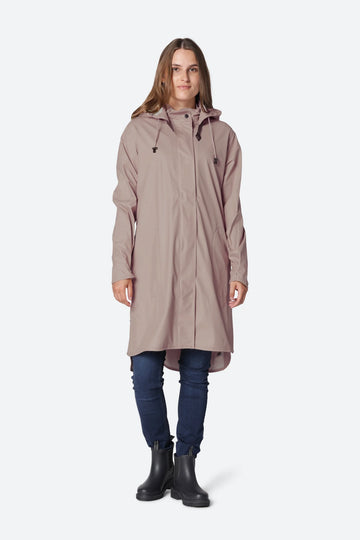 We are delighted to be stocking raincoats from Danish brand Ilse Jacobsen.  The brand is known worldwide for their iconic rainwear inspired by the Nordic environment.          This feminine A-line raincoat is made in a light waterproof fabric and features a detachable hood with artificial leather strap.   It is waterproof enough for the heaviest of showers.  Pair with the Ilse Jacobsen short black wellies to keep you dry on your walks! 