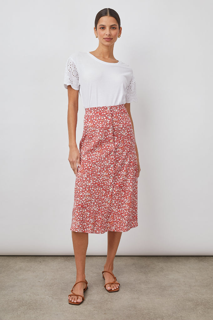 This is a great dress up or dress down skirt!  Crafted from lightweight rayon crepe Rosetta features a flattering bias cut, midi length, natural shell buttons at centre front and comes in a pretty red floral print.  Pair with a pretty cami and heels for evening or a white tee and trainers for a relaxed day look.