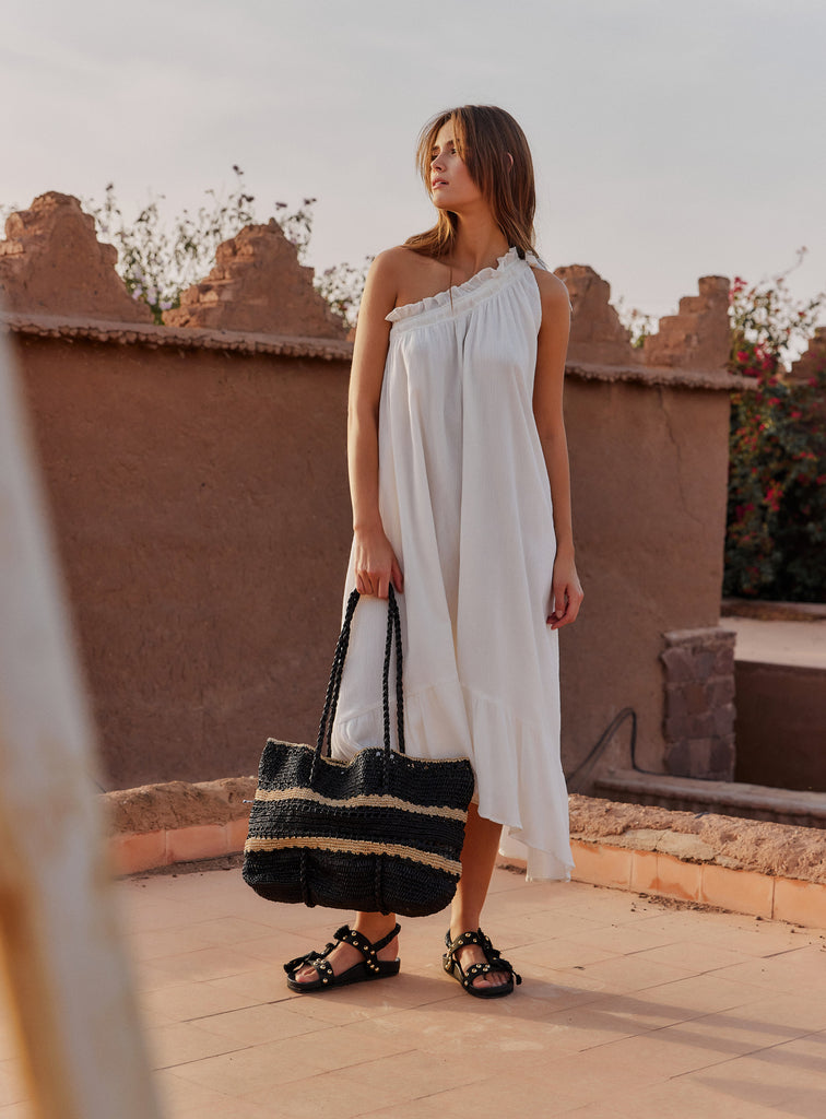 We are delighted to be stocking French brand Petite Mendigote.  The two-tone Raphael Bag is a classic look made from 100% raffia.  It features scalloped edging and shoulder straps.   It is the perfect tote bag for all your summer essentials!