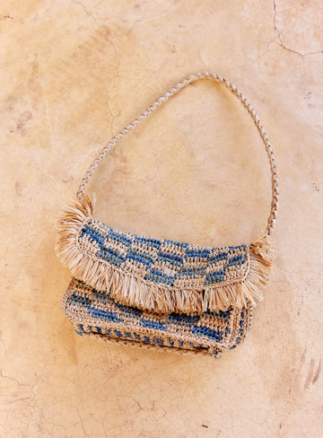 We are delighted to be stocking French brand Petite Mendigote.  The Renan Bag is a classic look made from 100% raffia.  It features fringed edging on the flap and a strap which can be worn on one shoulder or across the body.  It is a perfect addition to all your summer outfits!