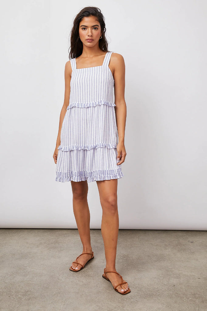 This effortless Sandy dress from Rails is the perfect throw-on-and-go staple for any occasion. This lightweight linen mini dress is lined and features a blue stripe print, a square neckline, a flowy tiered skirt and ruffle detailing.