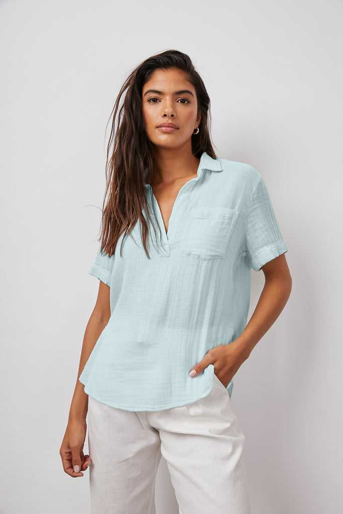 This effortless lightweight, cotton gauze, sky blue v-neck pullover from Rails features a relaxed fit, a half placket neckline, a patch pocket at the chest and rolled sleeves. Look refined and polished in this super soft, breezy style top.