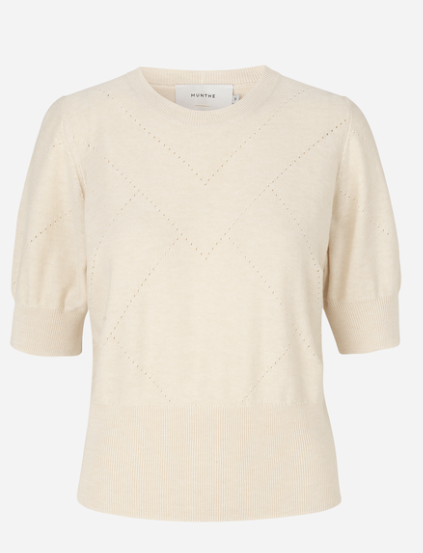 This short sleeved knit from Munthe features ribbing around the neckline, hem and sleeves.  There is a delicate hole-knit detail that makes this jumper unique.  Pair with a pretty skirt or your favourite denim.