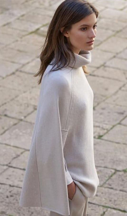 Stunning cashmere and wool blend poncho from Amina Rubinacci.  Giving a lovely slim silhouette and in a beautiful pale grey colour put this on and you will immediately feel effortlessly finished. 