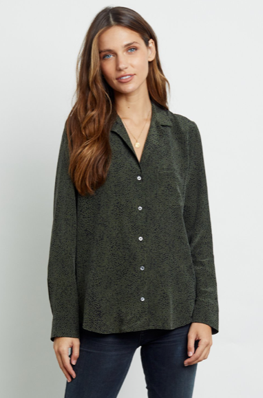 Long sleeve, 100% silk pyjama style button-down top featuring a khaki green coloured base with black spotted print and single chest pocket. Elevate your look in luxe silk fabrication while staying on trend with this cute and stylish print from Rails.
