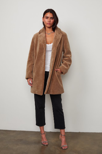 This eco friendly faux sherpa oversized coat will keep you warm and cozy throughout the winter months!  The coat is fully lined and has a collar that can easily be turned up to keep you extra toasty.  As is oversized can be worn over your extra big wooly jumpers as well.   
