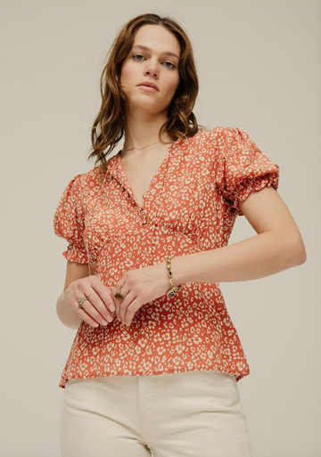 The Elizabeth top oozes femininity and vintage-ness.  Crafted from 100% pure silk with covered buttons, gathered mini frills around the neck, dainty cuffed short sleeves and neck ties in a hand painted floral leopard print this looks fab paired with your favourite denim.