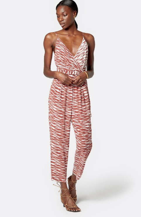 This takes the whole one and done thing to a new level!  Crafted from 100% silk in a pretty print this jumpsuit features a gathered and pleated waist for an always flattering fit, a sexy cross over neckline and our absolutely favourite thing - pockets!  Hitting the ankle this easygoing one piece creates the perfect silhouette.    