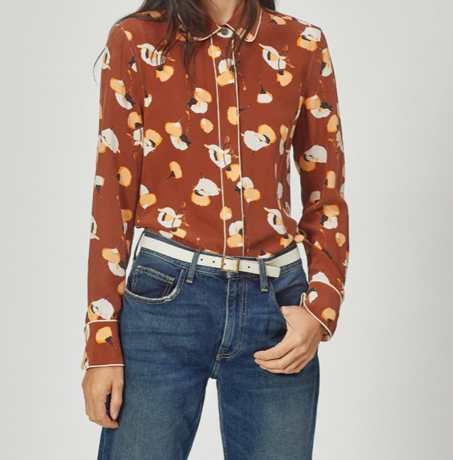 Gorgeous pyjama inspired shirt from Equipment.  Crafted from their signature super soft silk in a quirky print with piping and a button down front.  Pair with white denim to make the white in the print really pop!