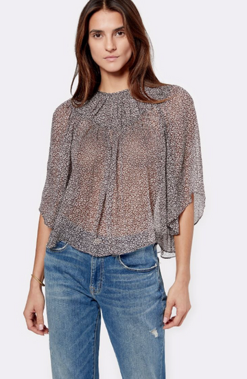 Gorgeous floaty semi-sheer top from Joie.  With bell sleeves, a high neck and relaxed fit this looks perfect paired with your favourite boyfriend jean to create a feminine tomboy look.