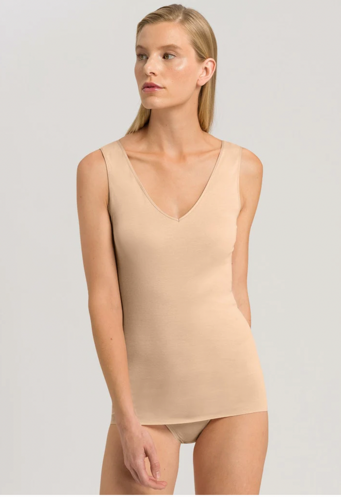 Another great piece from Hanro's Cotton Seamless collection is this super soft v-neck tank.  Crafted from only natural materials and featuring seamless and hem-less construction this literally feels like a second skin.  This is the perfect every day tank to wear under your jackets, blouses or knits.  You'll want this in every colour and it will quickly become a wardrobe staple.