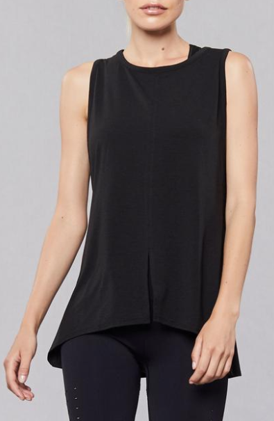 The Norton Tank is a long line silhouette with scooped armholes and a back opening for increased ventilation. Throw on post-workout for easy layering.