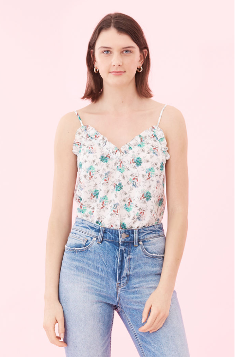 A dainty pretty cami from Rebecca Taylor.  Crafted from super soft silk and featuring pretty ruffle detailing at the neckline this is perfect paired with denim. 