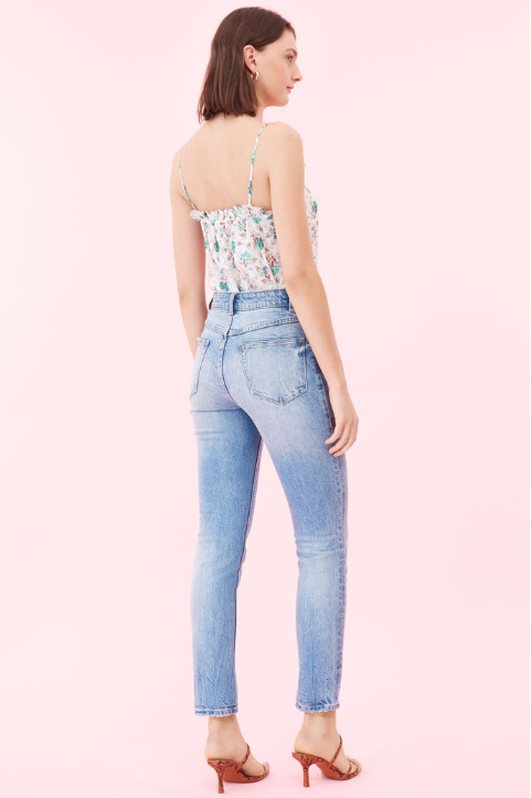 Tiny ruffles ripple along the sweetheart neckline of this silk tank.