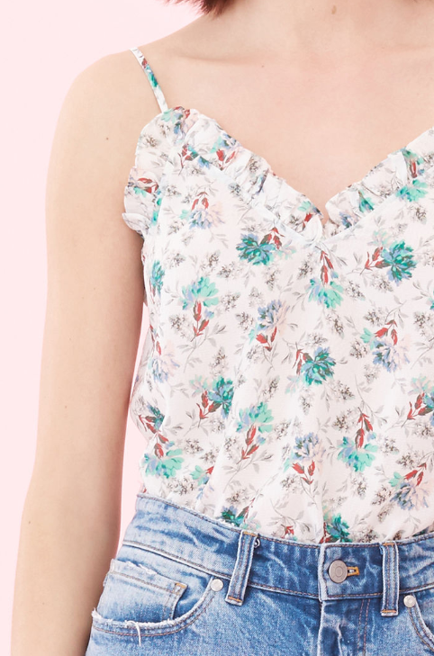 Tiny ruffles ripple along the sweetheart neckline of this silk tank.