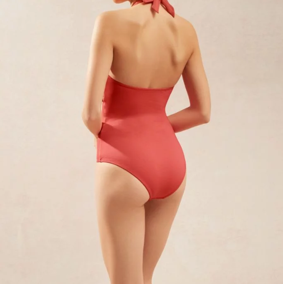 The body features a smocked embroidered underbust band. The neck and back ties are adjustable and bust padding is removable The underbust band is smocked with decorative embroidery with pretty frill edging and is elasticated for a secure fit.