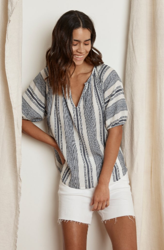 Crafted from a cotton woven jacquard this pop on blouse from Velvet is inspired by one of their favourite mediterranean vacation spots.  Featuring a v-neckline, a puffed sleeve that hits just at the elbow and a slight scoop to the hemline - let's go on vacation right away!