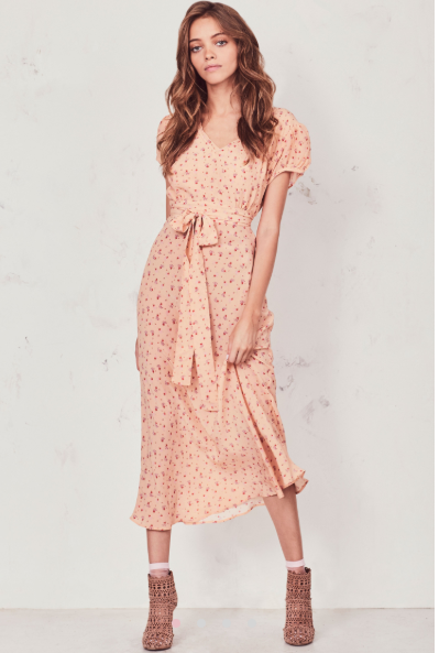 Our Meg Midi Dress radiates romance in washed silk crepe with a vintage-inspired tea rose print. This modern take on an old-fashioned country frock features a small ruffle detail that extends from the trimmed v-neck to classic puffed cap sleeves on each side. An easy fit skirt falls to mid-calf. Shown here in Sardinia.  **Please note the belt is not included with this dress