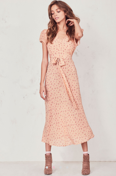 Our Meg Midi Dress radiates romance in washed silk crepe with a vintage-inspired tea rose print. This modern take on an old-fashioned country frock features a small ruffle detail that extends from the trimmed v-neck to classic puffed cap sleeves on each side. An easy fit skirt falls to mid-calf. Shown here in Sardinia.  **Please note the belt is not included with this dress