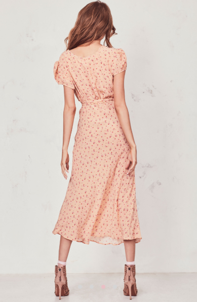 Our Meg Midi Dress radiates romance in washed silk crepe with a vintage-inspired tea rose print. This modern take on an old-fashioned country frock features a small ruffle detail that extends from the trimmed v-neck to classic puffed cap sleeves on each side. An easy fit skirt falls to mid-calf. Shown here in Sardinia.  **Please note the belt is not included with this dress