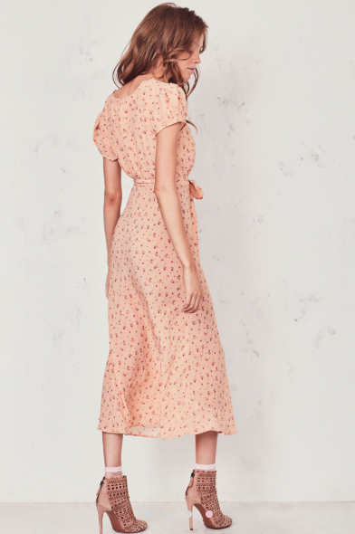 Our Meg Midi Dress radiates romance in washed silk crepe with a vintage-inspired tea rose print. This modern take on an old-fashioned country frock features a small ruffle detail that extends from the trimmed v-neck to classic puffed cap sleeves on each side. An easy fit skirt falls to mid-calf. Shown here in Sardinia.  **Please note the belt is not included with this dress