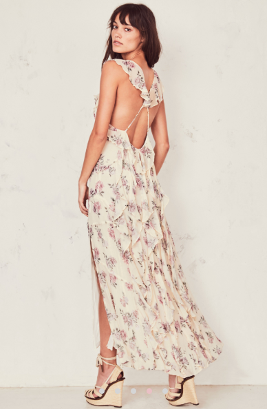 Reveal just enough in the Sally Dress in crinkle chiffon with hand-painted French roses. Our take on the classic slip dress has ruffles as straps, crossing with ties at back to expose skin. Raw-edged ruffles cascade below. A center front keyhole cinches with a tie, and a slit extends down the ankle-length skirt from mid-thigh. 