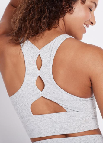 This mid intensity support Back in Action White Sports Bra has comfortable four way stretch and a very flattering back detail that sits flatly on your back.  The bra has removable padding and is created from a nylon/polyester/spandex mix that feels gentle like cotton and works hard to meet your technical requirements - it will move with you whilst still supporting you.  Shown here in a gorgeous white and black print it will look equally great with the matching leggings or simple black leggings.