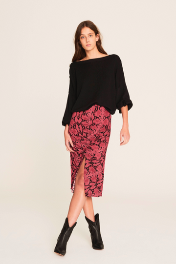 This is an ultra feminine skirt - with it's midi length, perfect slit, gathered elastic along the centre front for shape and in a pretty pink animal print.  Pair with a black jumper or a tee depending on your mood.