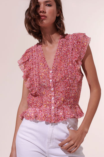 The Amanda Top from Poupette St Barth is going to be a go-to this season! Featuring a v-neckline, a button down front and pretty frill details - this floral blouse looks great with the matching Amanda Mini Skirt as well as your summer denim.