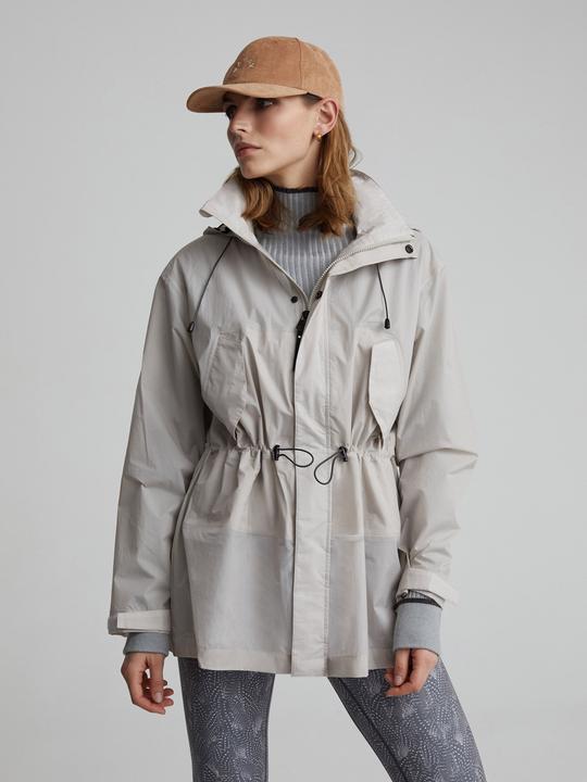 This lightweight Williams Rain Jacket is another staple designed by Varley. The cinched waist detail creates a structured silhouette and is perfect for layering on top of your chunky knit jumpers. This waterproof jacket also features secure pockets and a roll-away hood which makes it practical as well as stylish. 