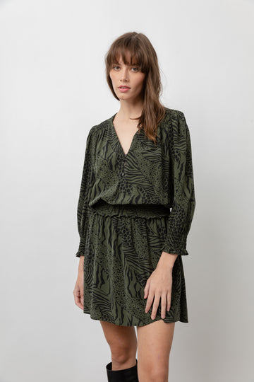 This beautiful Zana Mixed Animal Print Dress, is crafted from a lightweight rayon crepe in olive green. Featuring an eye-catching jet black mixed animal print throughout, the v-neckline, elasticated waist and full sleeves create a flattering feminine look that is wearable day to day with a pair of D.A.T.E trainers or throughout the night paired with black chunky boots. 