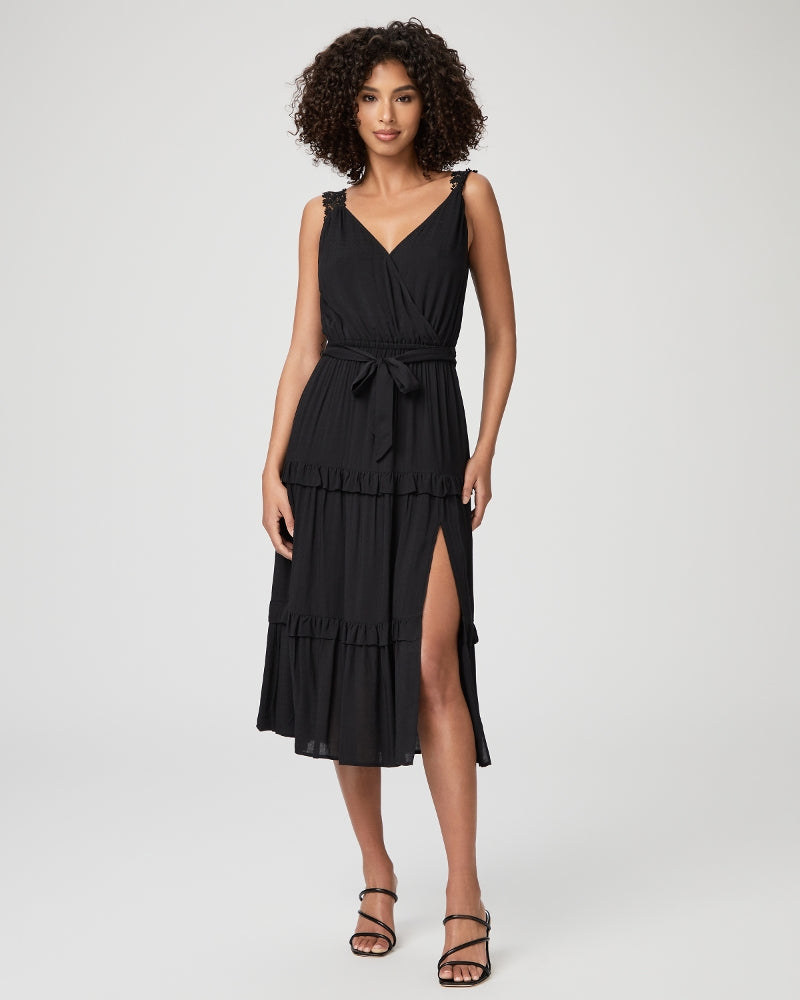 The boho inspired Riviera dress is both feminine and romantic with beautiful lace daisy pattern straps, a faux-wrap front with hook and eye closure, a tiered skirt with ruffle hem and a thigh-high side slit. Crafted from a light textured rayon this midi dress is perfect for any occasion. 