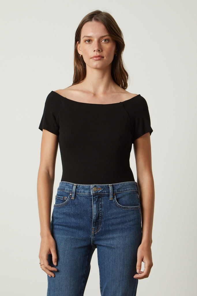 Who doesn't love a bodysuit!!!  Crafted from Velvet by Graham & Spencer's signature super soft fabric and featuring a flattering neckline this is perfect for when you want a streamlined silhouette.  In always wearable black this is perfect with your high waisted denim!
