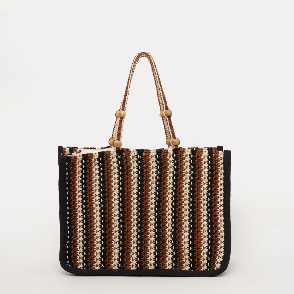 We are delighted to be stocking French brand Petite Mendigote.  This stylish macrame tote bag has long handles with bead detailing, an inside pocket and push button closure.  It can be carried in your hand or over your shoulder.  Use it for all your shopping or holiday essentials, and pair it with the matching pouch to carry smaller items and then use as a clutch!