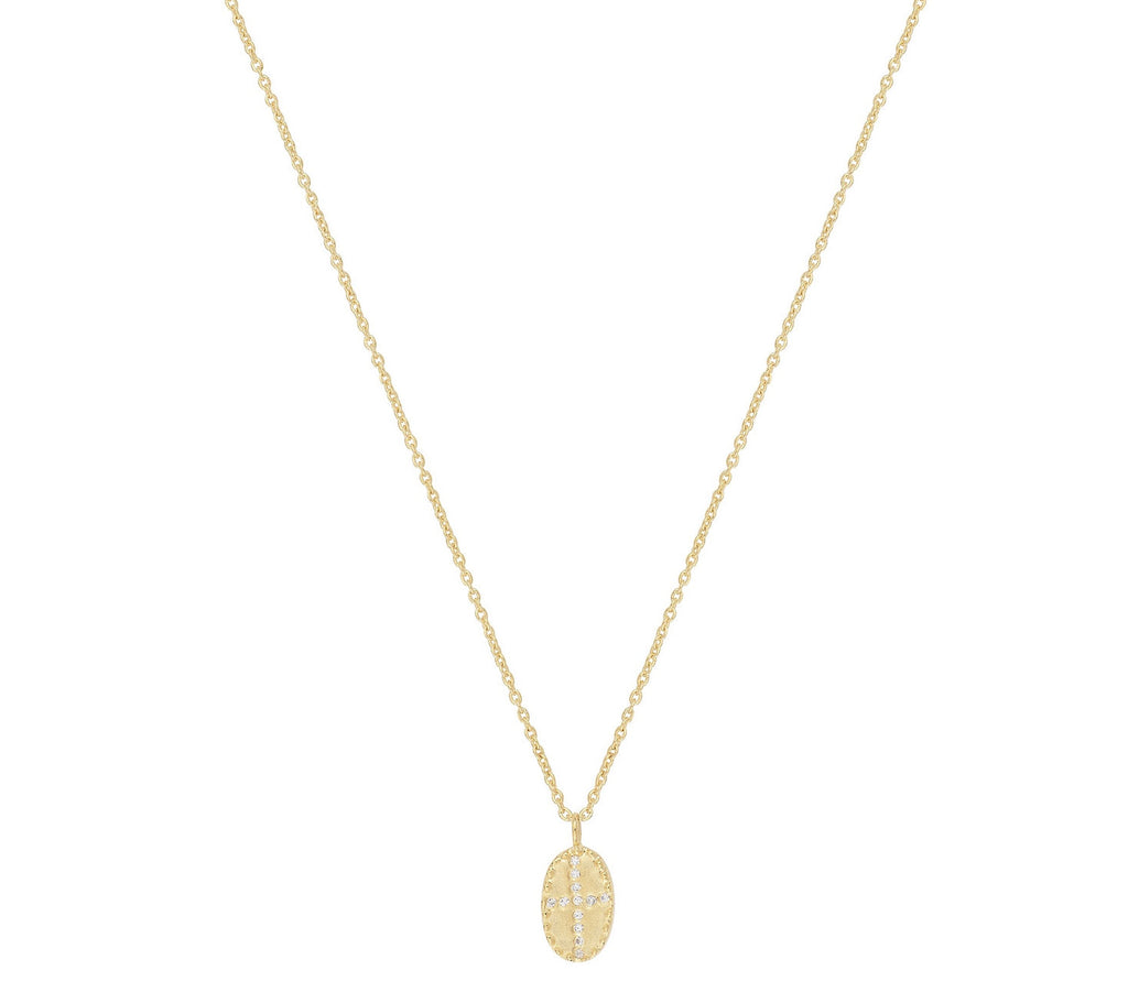 The By Bazile Mini White necklace from Louise Hendricks features a brushed and matte oval 3 micron gold plated pendant with white zircons set in an irregular cross shape. Length 39 cm + 4 cm extension.