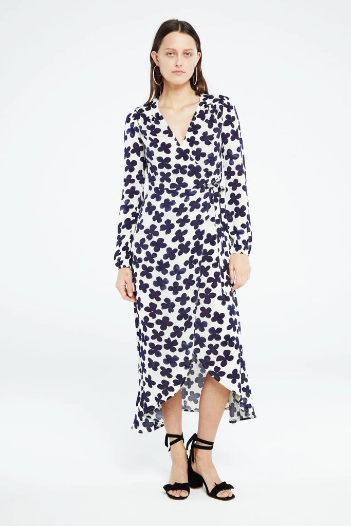 This midi wrap dress from Fabienne Chapot features a V-neckline, lining, long sleeves with elastic cuffs and ruffle details. The Natasja Frill Dress an all over, eye-catching Treboli Navy print.