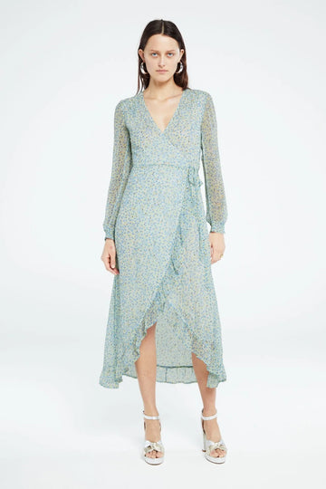 This midi wrap dress from Fabienne Chapot features a V-neckline, lining, long sleeves with elastic cuffs and ruffle details. The Natasja Frill Dress has beautiful glitter lurex details and an all over Cala Blanca print.