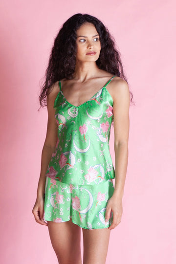 This fab little PJ set features a 100% silk slip on cami with hand painted flamingos circling in the night's sky and matching silk shorts with a pretty pink drawstrings.  Super comfy et also feminine and fun!