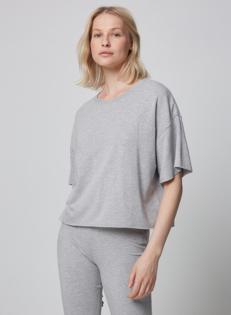 This light grey t-shirt from Majestic Filatures is crafted in Viscose with a slight touch of Elastane adding comfort and softness. Featuring short sleeves with dropped shoulders, free edge finishings and an oversized boxy cut, this light weight tee can be worn with high waisted jeans or the matching lounge-wear bottoms. 
