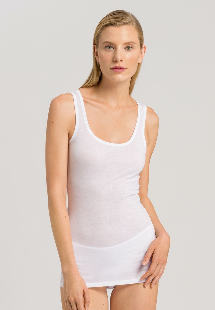 The Ultralight range from Hanro is their lightest and airiest collection and is crafted from super soft Supina lightweight cotton ensuring a light feel and quick drying making it a great choice for when the weather is warmer but you still want a layer.  This tank features a flattering low round neckline and a neat fit.  